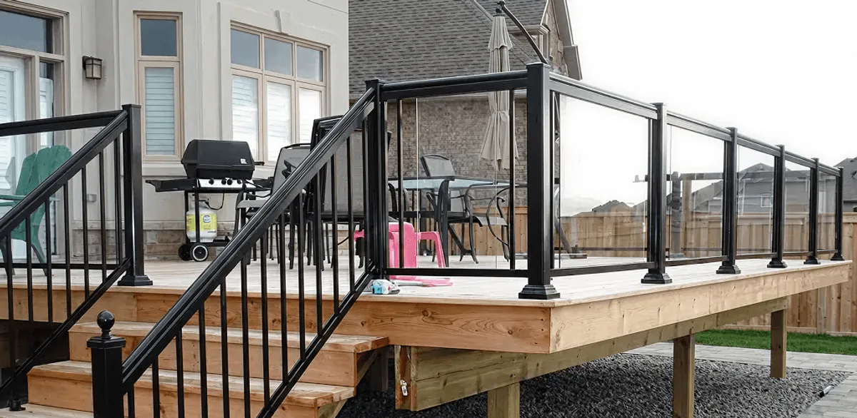 Handrail installation on a deck staircase for safety and code compliance in Buffalo, NY